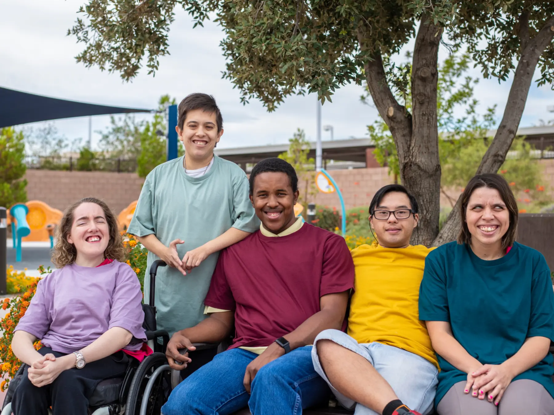 A diverse group of adults with intellectual and developmental disabilities spending time together outdoors