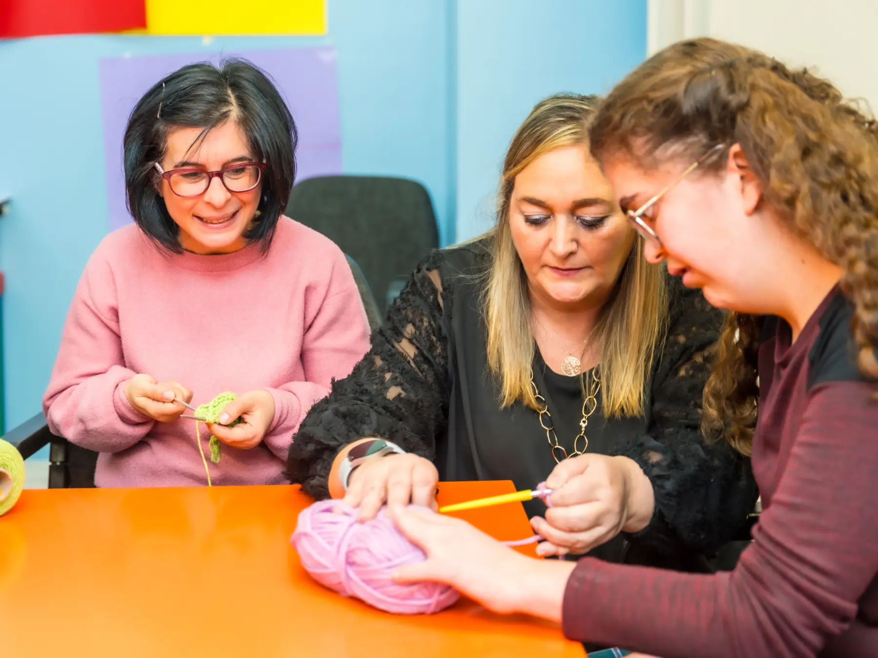 Adults learning a creative skill together with support