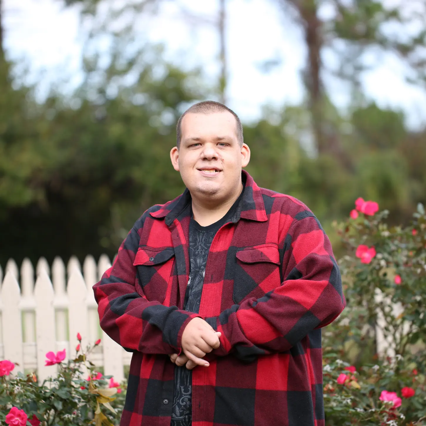 An adult with IDD participating in a neighborhood garden