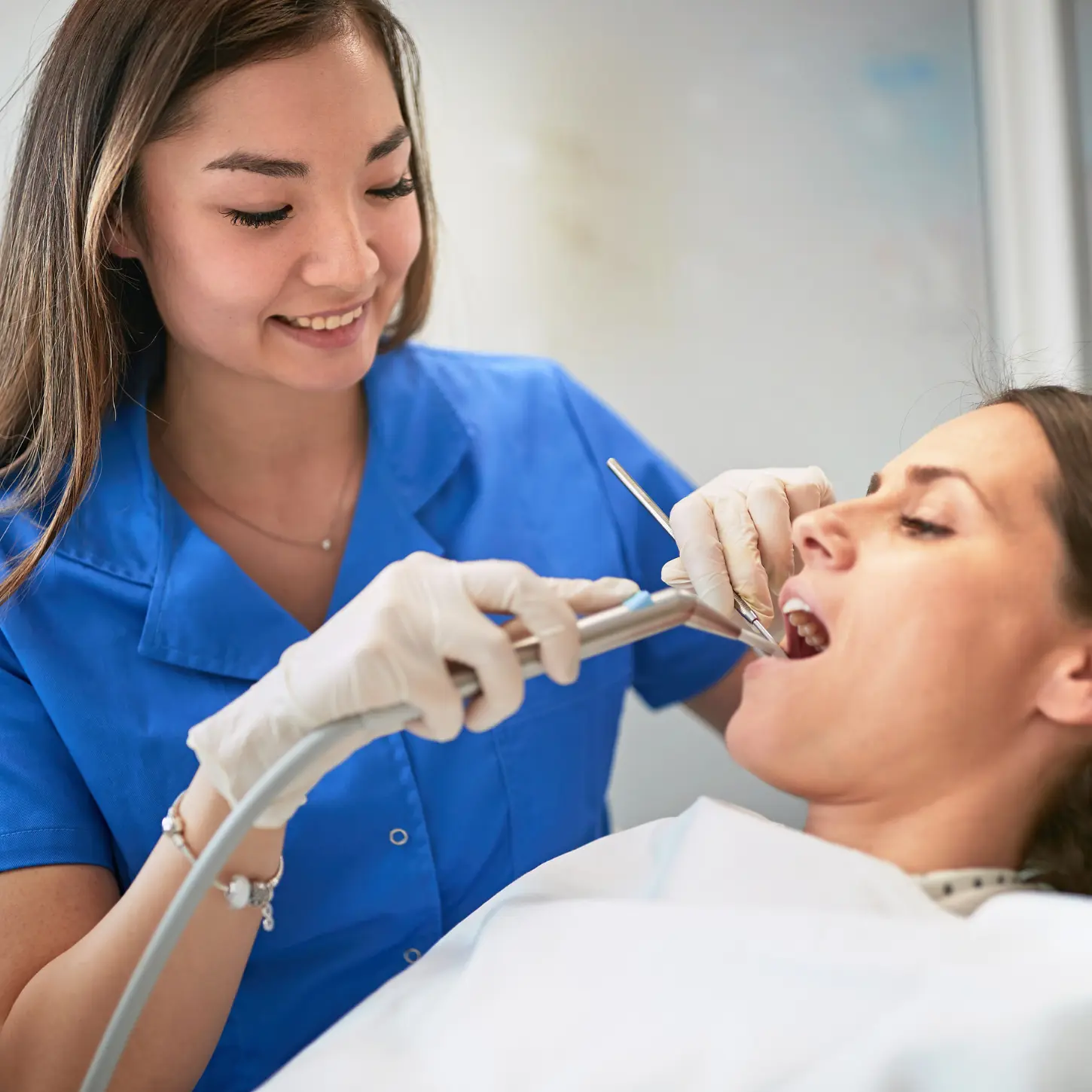A dental professional providing oral care