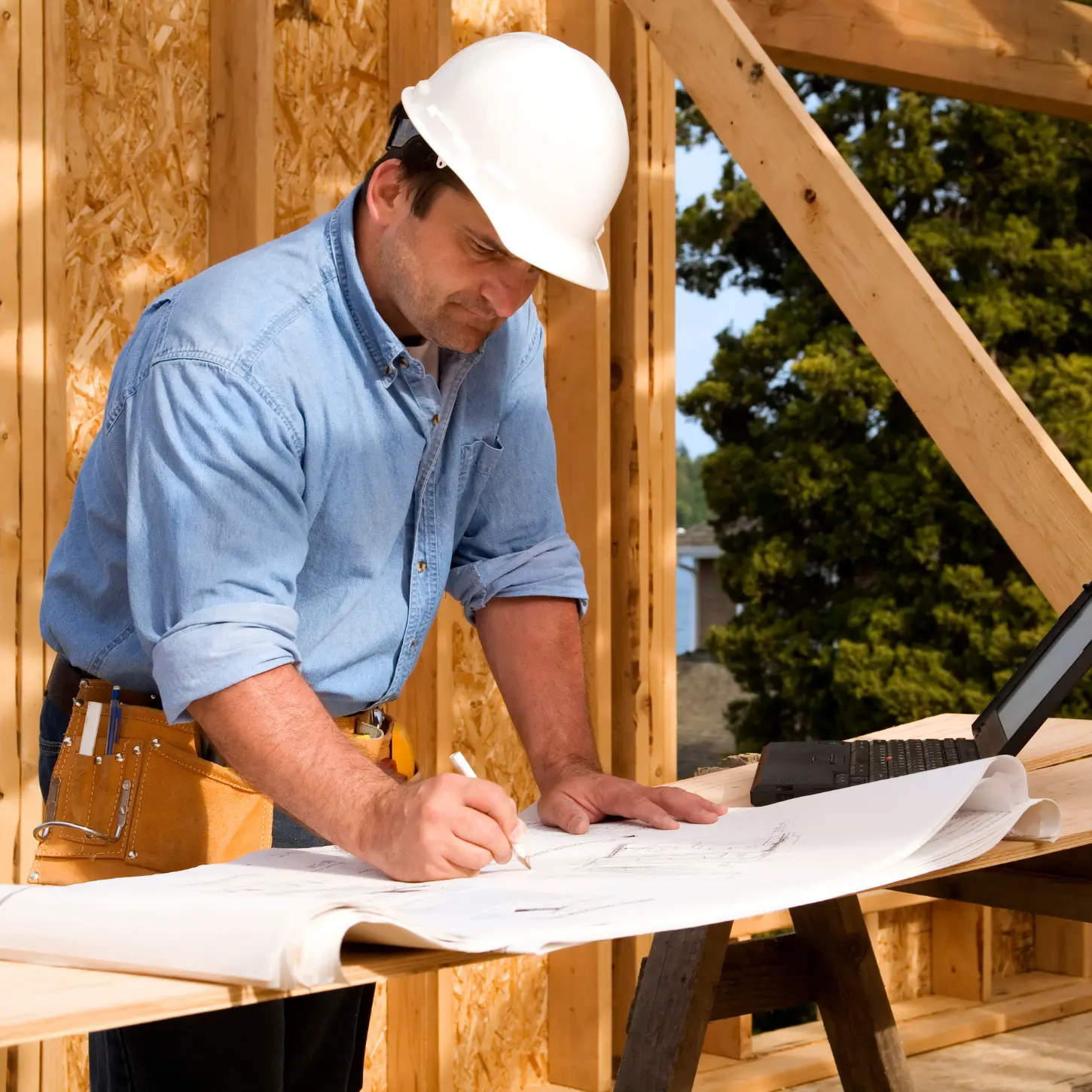 A contractor reviewing plans for an accessible home modification