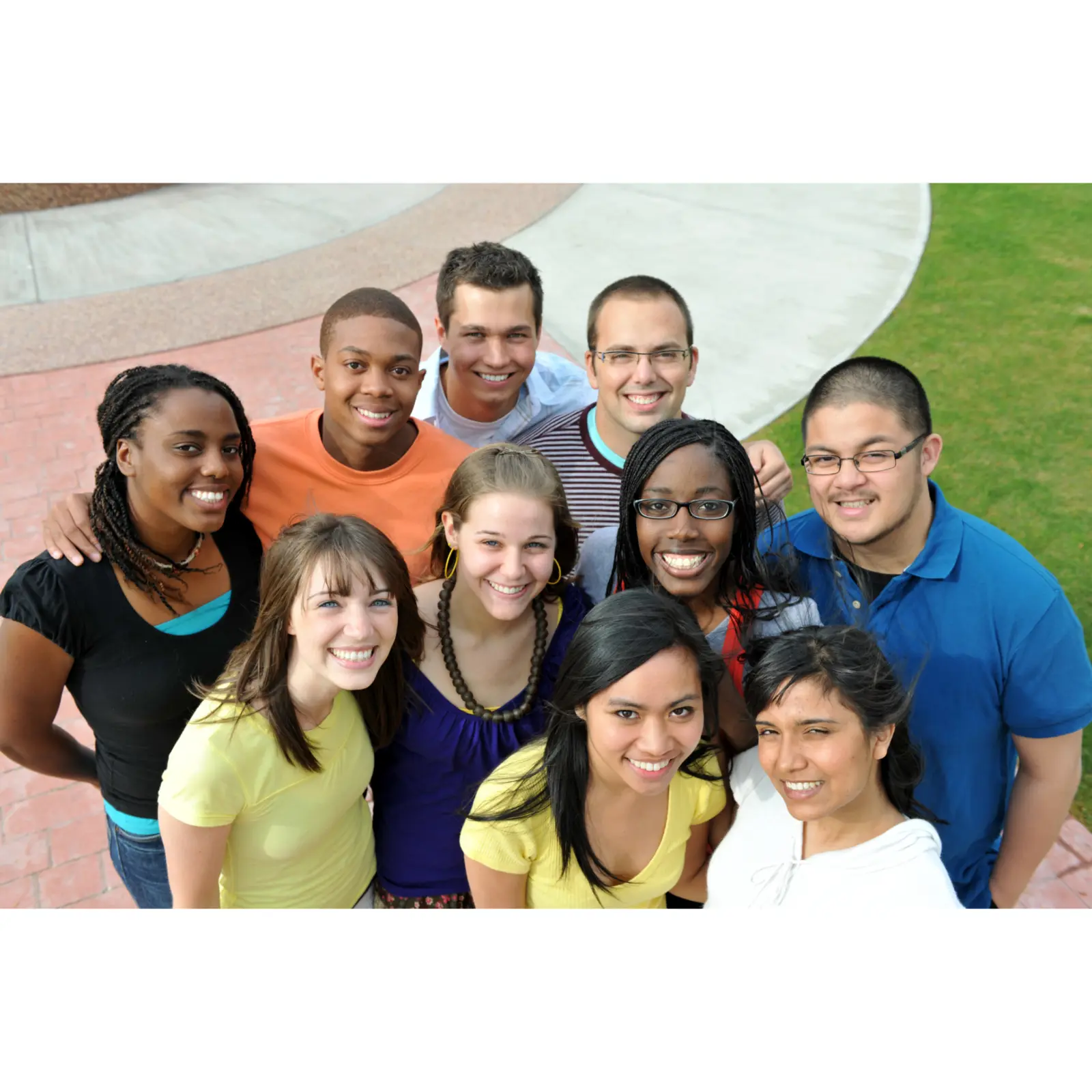 A diverse group of young adults smiling together in the community